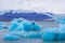 Beautiful photo of Jokulsarlon Glacial lake full of blue floating icebergs.