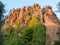 Beautiful photo of a mountain of stones very high with vegetation