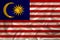 Beautiful photo of the national flag of Malaysia on delicate shiny silk with soft draperies, the concept of state power, country