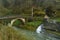 Beautiful Photo Of Postcard With A Brave River, A Roman Bridge And A Wonderful Mini Houseboat In The Natural Park Of Gorbeia. Arch