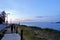 A beautiful photo of a young woman walking along the waterfront of Port Hardy, British Columbia, Canada