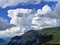 Beautiful photogenic clouds over the Iberig region and slopes of the Schwyz Alps mountain massif, Oberiberg - Canton of Schwyz