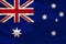 Beautiful photograph of the colored national flag of the modern state of Australia on textural fabric, concept of tourism,