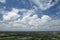 Beautiful photograph featuring city and forest landscapes with a white clouds, Sky background