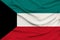 Beautiful photograph of the national flag of Kuwait on delicate shiny silk with soft draperies, the concept of state power,