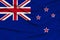 Beautiful photograph of the New Zealand national flag on delicate shiny silk with soft draperies, the concept of state power,