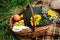 Beautiful picnic wicker basket with colorful bouquet fruits and