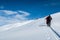 Beautiful picture of skiers climbing the snowy mountain at daytime