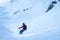 Beautiful picture of a sportsman carving on a snowboard on a snowy mountain