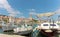 Beautiful picturesque waterfront view of a small town of Sutivan on the island of Brac. Old boats docked in the harbour, belltower