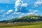 Beautiful picturesque Zlatibor region landscape with distinctive architectural style houses scattered over green hills