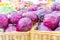 Beautiful pile of red cabbage purple cabbage, in baskets, being sold at a farm stand market farmer`s market