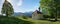 Beautiful pilgrimage chapel at the hill, trees and mountain view, upper bavaria in may