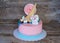 Beautiful pink baby cake with candy and marshmallow