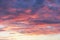 Beautiful pink dramatic cirrus clouds on a background of the evening sky. Concept for desktop background, natural texture, nature