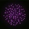 Beautiful pink firework. Bright firework isolated on black background. Light purple decoration firework for Christmas