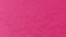 Beautiful pink or fuchsia bright background. Scarlet, purple, uneven color. A sheet of colored paper with a soft fleecy texture