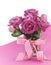 Beautiful pink gift of roses on pink and white background