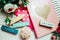 Beautiful and pink notebooks and flowers on a white wooden background with clothespins in spring