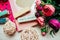 Beautiful and pink notebooks and flowers on a white wooden background with clothespins in spring