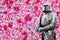 Beautiful pink peonies. Medieval knight in armor. Romantic knightly picture