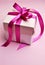 Beautiful pink present gift in white box and polka dot lid.