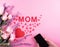 Beautiful pink roses, red hearts and mobile with Mothers day message .