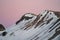 Beautiful pink sky at sunset on the slopes at Mammoth Mountain Ski area. Photo taken in the summer season, with snow still on the