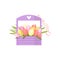 Beautiful pink spring flowers tulip bouquet in wooden box with handle decorated heart over white