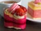 Beautiful pink yogurt cake decorate with macaron and strawberry