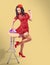 Beautiful pinup housewife standing with iron and ironing board