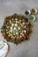 Beautiful plate display of homemade Labane cheese balls with Olive oil, za`atar pita bread toast and fresh vegetabl