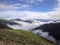 Beautiful plateau meadows, snowy mountains and misty peaks