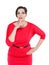 Beautiful plus size woman in red dress with finger on lips isolated