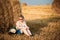 Beautiful Plus Size Young Woman In Shirt Sit Near Hay Bales In Summer