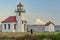 The Beautiful Point Robinson Lighthouse with Mount Rainier in the Backdrop during Sunset