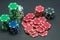 Beautiful poker chips stacked on black background