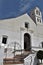 Beautiful portal of San Antonio church with art iron bars and steps in Frigiliana - Spanish white village Andalusia
