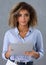 Beautiful portrait of black hispanic woman holding clipboard with business documents