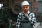 Beautiful portrait. Factory male worker in uniform is indoors