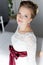 Beautiful portrait of a gentle cute happy bride in a white dress with a bright little colored bouquet