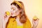 A beautiful portrait of a girl who eats a lemon, bites off a slice of lemon, a girl sniffs a lemon. Health, skin beauty, lemon-