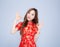 Beautiful portrait happy Chinese New Year young asian woman wear cheongsam fashion smile and cheerful with gesture ok