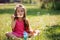 Beautiful portrait of sweet lovely little girl blowing soap bubbles