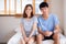 Beautiful portrait young asian couple relax and satisfied together in bedroom at home, family sitting on bed