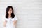 Beautiful portrait young asian woman happy open the book with cement or concrete background