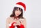 Beautiful portrait young asian woman in Santa holding smartphone in xmas day  on white background