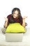 Beautiful portrait young asian woman sit on the floor with laptop and headphone on white background.