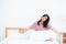 Beautiful of portrait young asian woman stretch and relax in bed after wake up morning at bedroom