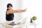 Beautiful portrait young asian woman stretching muscle arms after working with laptop